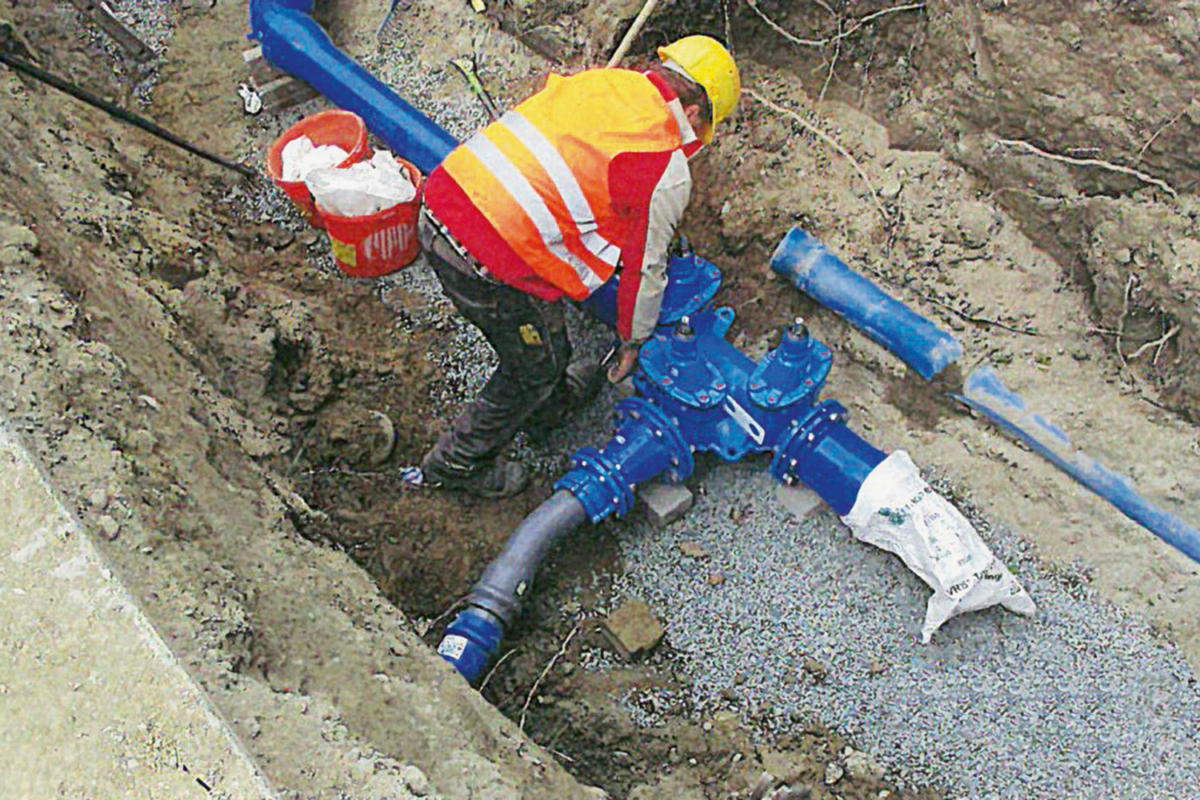 Installation of various valves and hydrants in the piping network.