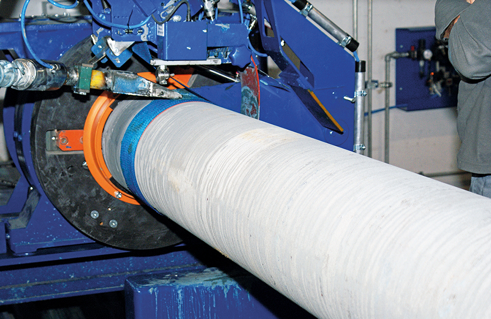 TRM cast iron pipes: fibre cement coating applied in a fully automatic extrusion process